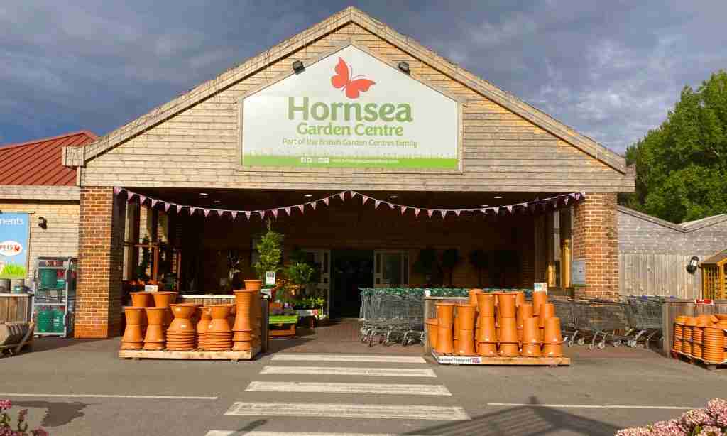 Front shot of Hornsea garden center with plant pots stacked in the front