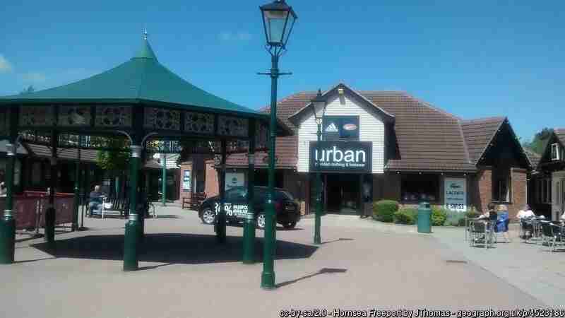 Photo of the bandstand at Hornsea Freeport with a blue sky above and Urban shop in the background