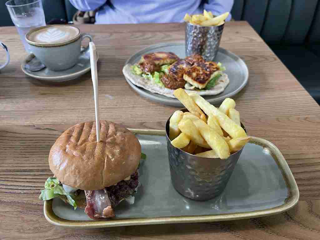 Smash burger and chips with a halloumi flatbead at the cakery
