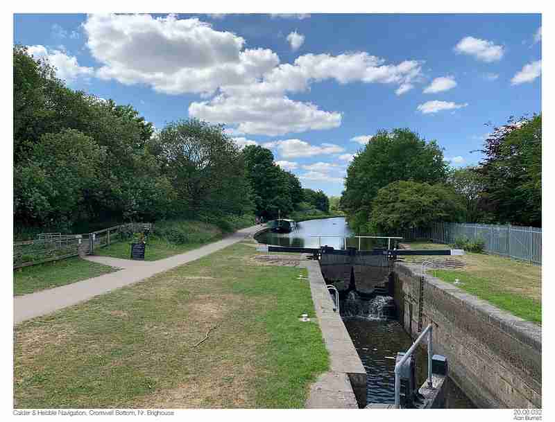 Front shot of Cromwell Bottom nature reserve in Brighouse Halifax with a blue sky and trees in the background