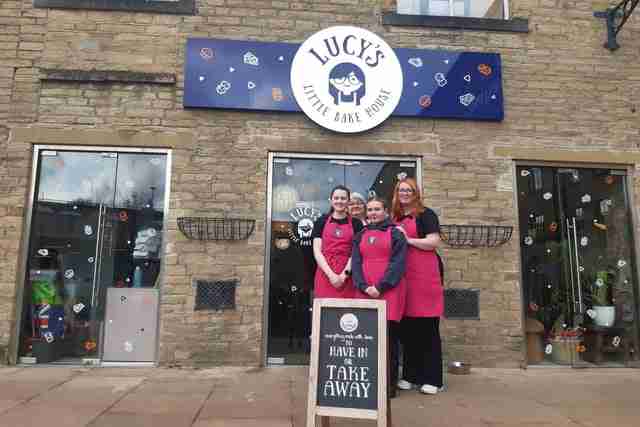 Lucy's Little Bakehouse staff in front of the cafe at Dean Clough Mills Halifax