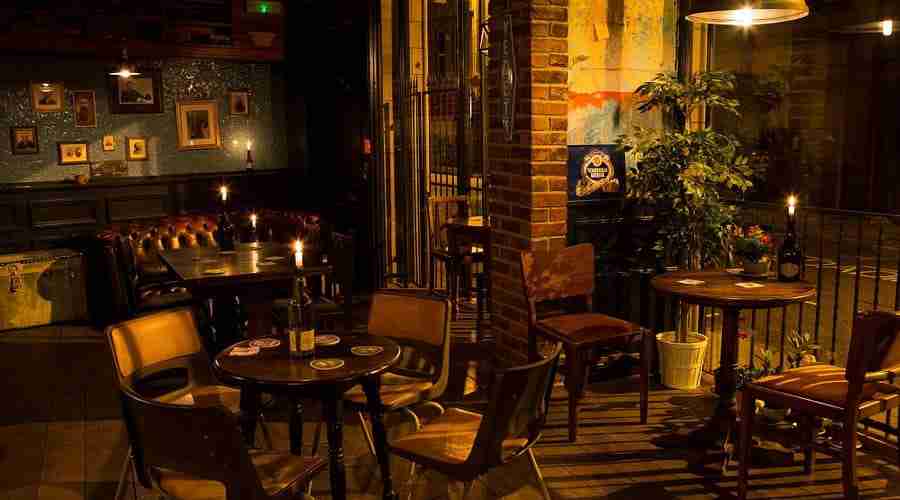 Interior of the dog friendly Victorian Craft Beer Cafe in Halifax at night with no people in.