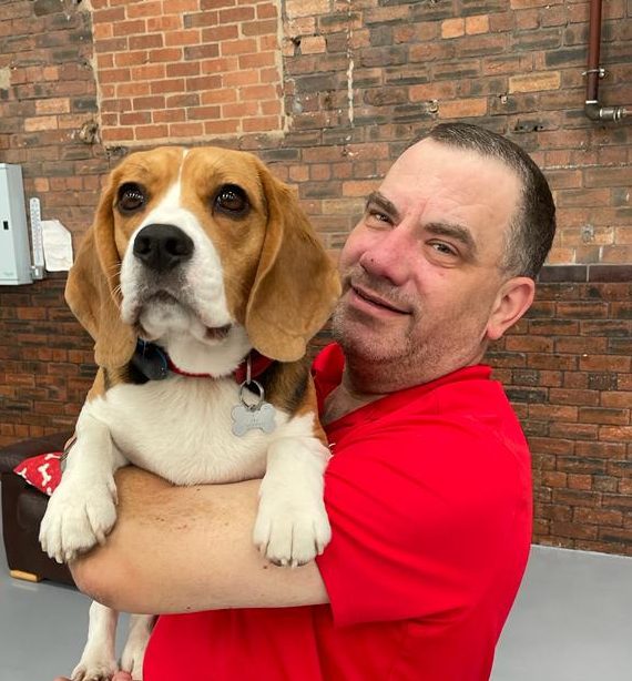Yappy Days owner John Lyons holding his beagle Louis at the doggie day care facility in Sowerby bridge